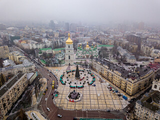 Aerial drone view. Sophia Church in Kiev. New Year tree in the square near the church.