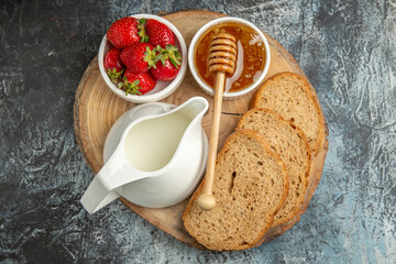 top view fresh strawberries with honey and bread on dark background fruit sweet jelly