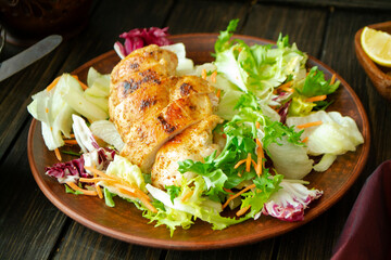 Grilled turkey fillet with vegetables on dark background, roast chicken