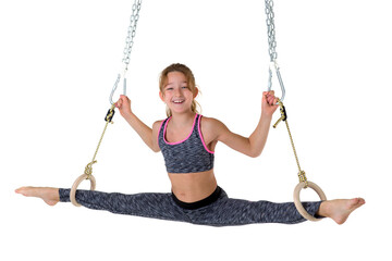 Girl performing twine on gymnastic rings