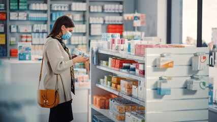 Pharmacy Drugstore: Portrait of Beautiful Young Woman Wears Protective Face Mask, Searches to Buy...