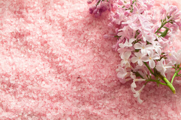lilac bath salt and some fresh lilac flowers in pink color