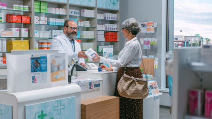 Pharmacy Drugstore Checkout Cashier Counter: Portrait of Friendly Pharmacist Recommending Medicine...