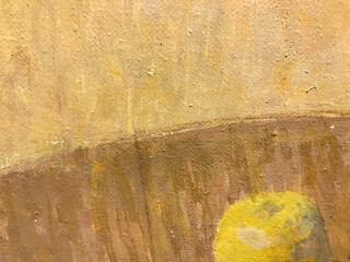 beige texture. application of yellow and orange paint on canvas. apple on the background. the...