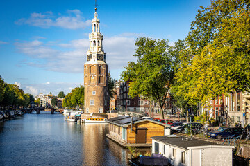 Naklejka premium tower on a calm canal in Amsterdam 