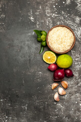 top view raw rice with onions and garlic on dark desk raw food ripe salad