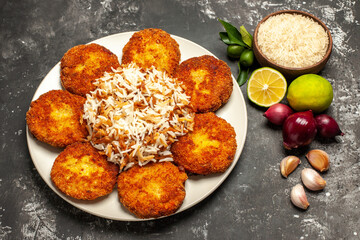 top view fried cutlets with cooked rice on dark background meat food dish rissole