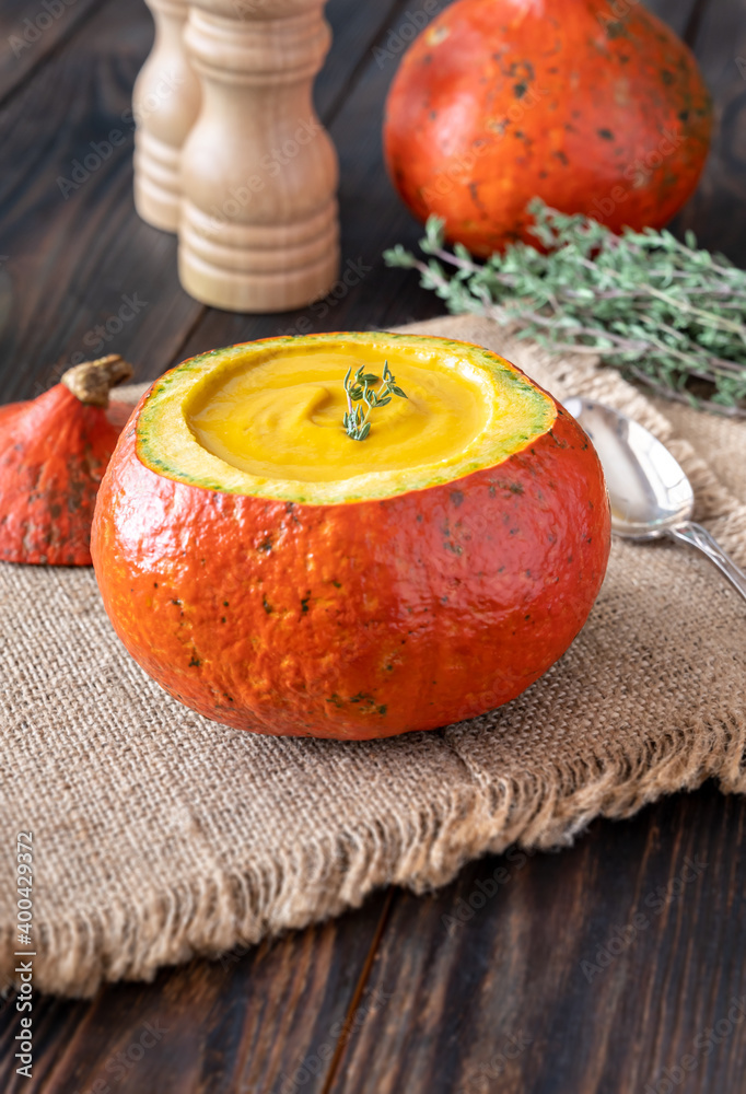 Wall mural pumpkin soup served in hokkaido pumpkin