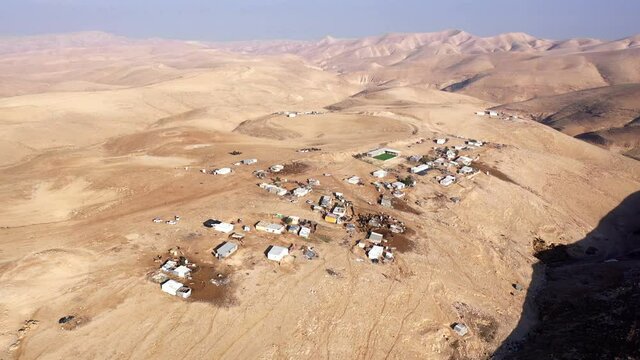 Bedouin camp Isolated in Judaean desert Aerial view
Drone footage over Bedouin outpost Close to Israeli City Maale Adumim Aerial, Israel
