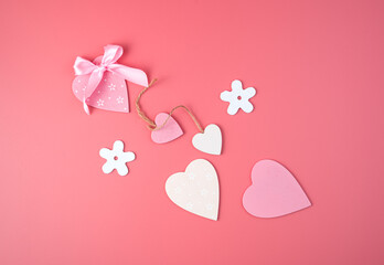 White rectangular frame with a red heart in the center on a pink background. Side view, with space to copy. Concept of February 14, love.