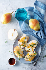 Blue cheese pear thyme toasts in a plate
