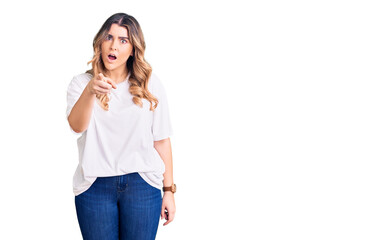 Fototapeta premium Young caucasian woman wearing casual clothes pointing displeased and frustrated to the camera, angry and furious with you