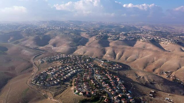 Israel and Palestine towns in the Judaean desert, Aerial
Maale adumim al-eizariya town And kedar, Aerial view. 
