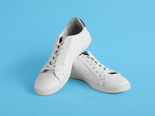 Casual male shoes on color background