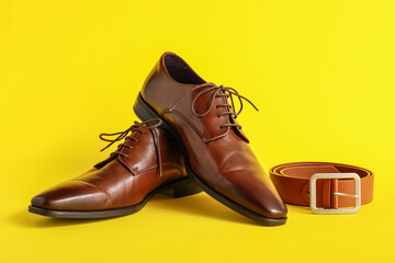 Classic leather male shoes on color background