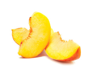 Fototapeta na wymiar Pieces of ripe peach on white background