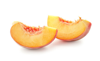 Pieces of ripe peach on white background