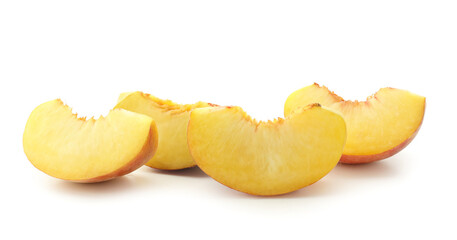 Pieces of ripe peach on white background