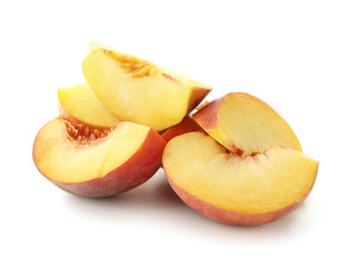 Pieces of ripe peach on white background