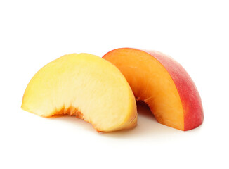 Pieces of ripe peach on white background