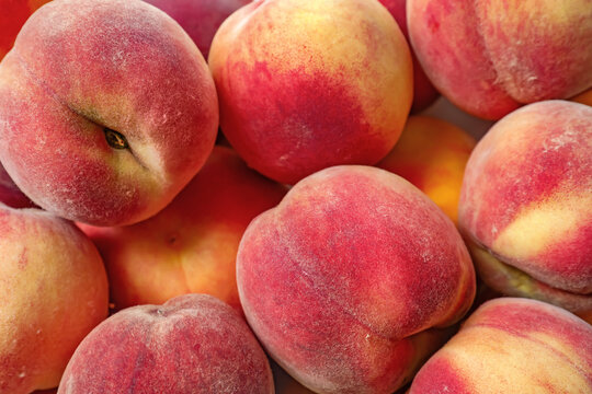 Sweet ripe peaches as background