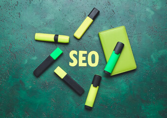 Abbreviation SEO with stationery on color background