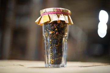  natural tea in a glass jar background blurred with place for text
