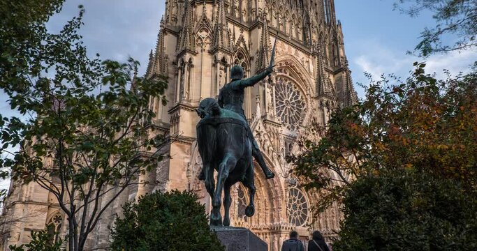 Time-laps of Jeanne d Arc statue and Reims cathedral facade, summer, Reims, Champagne, France