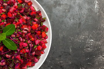 top close view of left side salad with vegetable on gray background