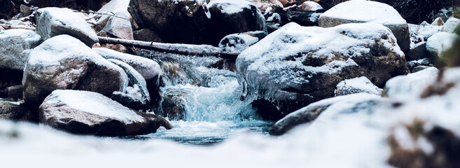 Frozen river with snow covered landscape. Winter landscape. Mountain, cold, christmas concept. Panoramic view.