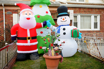 New York, USA - December 25, 2019: A street, house and porch decorated for Christmas and New Year in the Dyker Heights neighborhood.