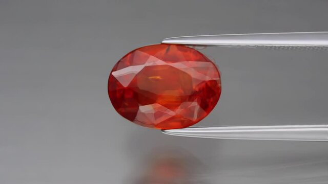natural garnet spessartine on the grey background