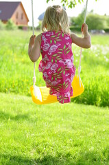 little girl on swing