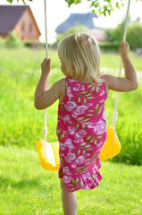 little girl on swing