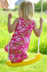 little girl on swing