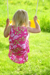 little girl on swing