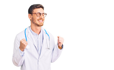 Handsome young man with bear wearing doctor uniform excited for success with arms raised and eyes closed celebrating victory smiling. winner concept.