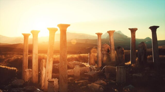 old greek temple ruins at sunset