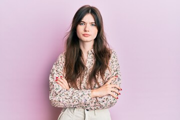 Fototapeta premium Young beautiful caucasian girl wearing elegant clothes skeptic and nervous, disapproving expression on face with crossed arms. negative person.