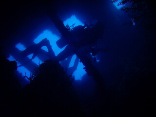 Silhouette of diver penetrating wreck Santa Catharina in Abrolhos Marine National Park