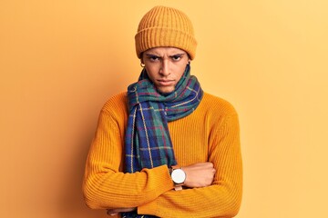 Young african amercian man wearing casual winter clothes skeptic and nervous, disapproving expression on face with crossed arms. negative person.