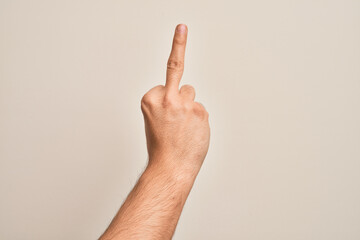 Hand of caucasian young man showing fingers over isolated white background showing provocative and...