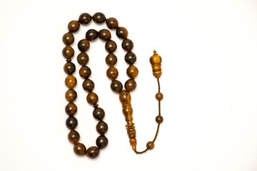 Brown prayer beads on white background