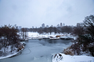 Snow covered trees and buildings are seen from Belvedere Castle in Central Park, New York City