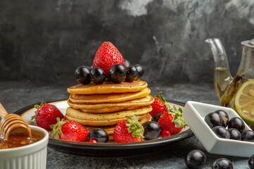 front view yummy pancakes with fresh fruits on light background fruit sweet cake