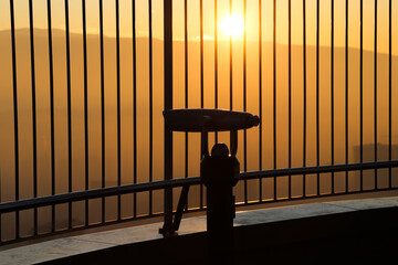 Binoculars on roof of skyscraper