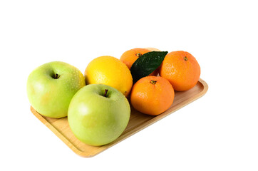 Fruit on a wooden tray. Apples, tangerines and lemon isolated on a white background.