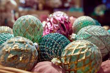 many of Christmas balls of blue and green gold colors
