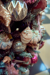 bright different Christmas toys on a tree