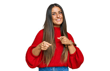 Beautiful hispanic woman wearing casual clothes pointing fingers to camera with happy and funny face. good energy and vibes.